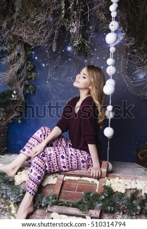 Girl in pajamas on the roof under a starry sky