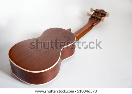 Ukulele Hawaii guitar on white background back