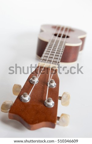 close up Ukulele Hawaii guitar on white background