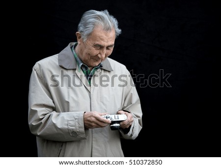 photographer, an old man with a camera
