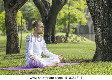 man with meditation at park