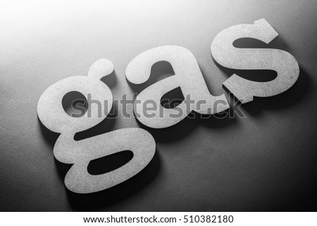 Petroleum, refinery & natural gas industry and business theme. The word GAS to be composed volumetric lowercase letters on matte backgrounds. Light falls from upside sources. BW photo. 