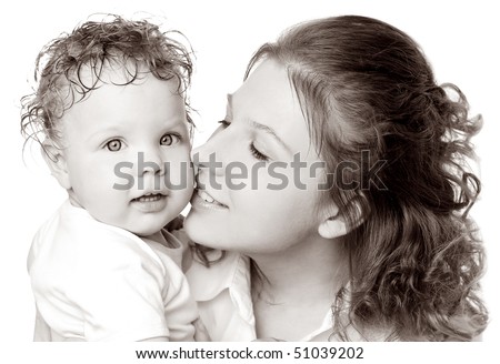 A mother kissing her cute baby