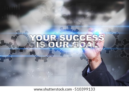 Businessman is drawing on virtual screen. your success is our goal concept.