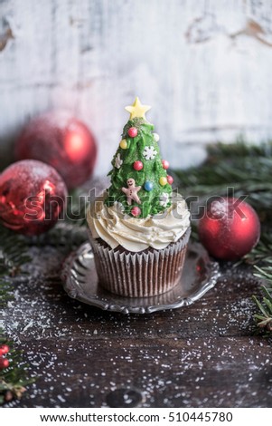 Sweet homemade Christmas tree cup cake,selective focus 