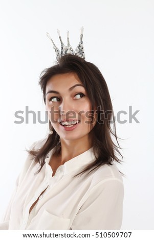 Happy young woman in princess crown
