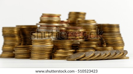 Pile of coins isolated on white background
