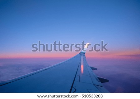 flying above the beautiful clouds in the early morning sky