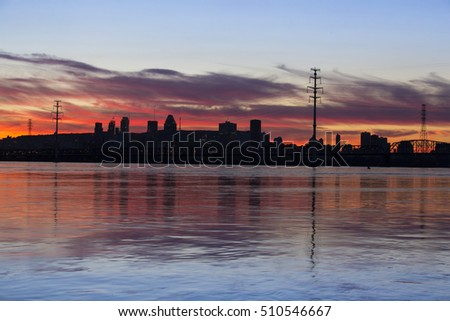 Blue hour in downtown Montreal reflected in st Lawrence river , Quebec, Canada