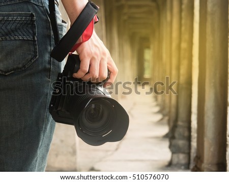 photographer holding his camera.