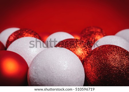 red and white baubles on red background
