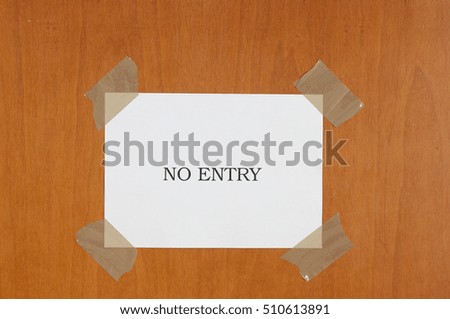 sign hanging on the door that says "No entry"