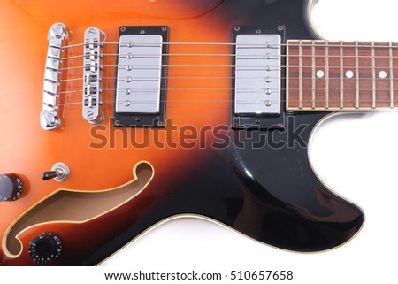 The electric jazz guitar close up.