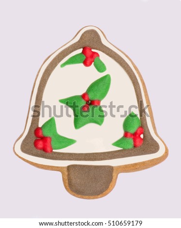 Gingerbread christmas bell decorated with white and green glaze