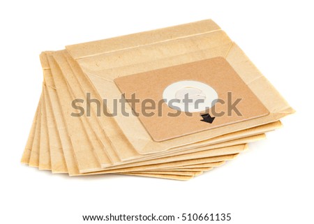 Garbage bag for a vacuum cleaner isolated on white background. Pile of standard dust paper bags for the electric vacuum cleaner.
