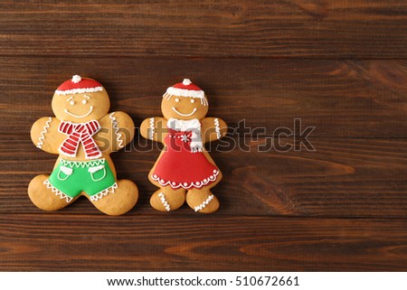 Tasty Christmas cookies on wooden background