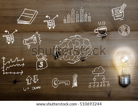  Business idea concept with crumpled  paper and light bulb on wooden table