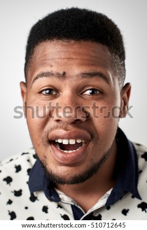 funny silly face expression of real person having fun isolated in studio 