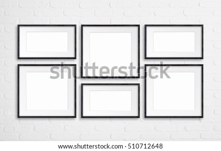 Collage of black wooden frames on white  bricks wall Royalty-Free Stock Photo #510712648