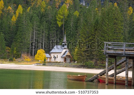 A beautiful autumn picture of the church near the lake on Fanes-Sennes-Braies natural park in the Dolomites in South Tyrol, Alps, Italy. (mental vacation, holiday, inner peace, harmony - concept)