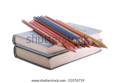 Isolated books and color pencils on white background