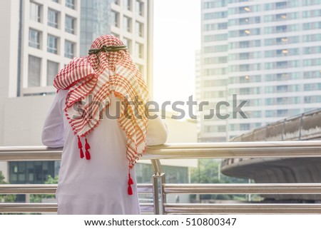 Arab businessman thinking or entrepreneur looking in the city Royalty-Free Stock Photo #510800347