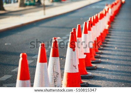 Road work. Orange traffic cones in the middle of the street.  Royalty-Free Stock Photo #510815347
