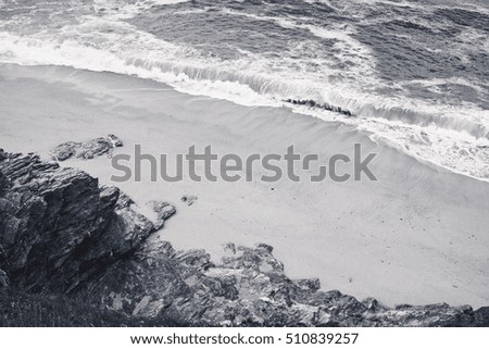 Moody black and white clifftop view seascape cresting wave