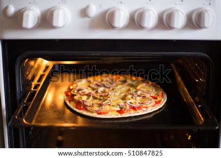 Pizza baking in the oven 