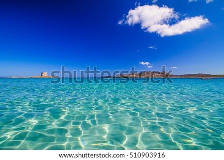 La Pelosa, Stintino, Sardinia, is one of the most beautiful sandy beaches of the Mediterranean. Turquoise water. La Pelosa Beach, Sassari, Sardegna, Italy. Royalty-Free Stock Photo #510903916