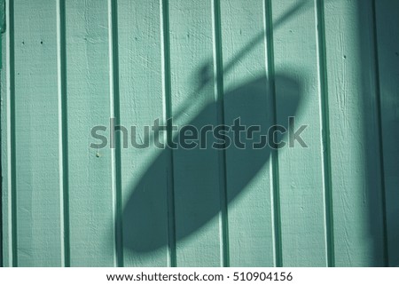 The shadow of the lantern on the wall