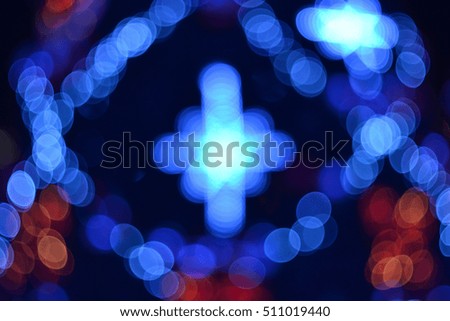 Glowing Christmas Star. Soft focus Christmas Tree Lights background