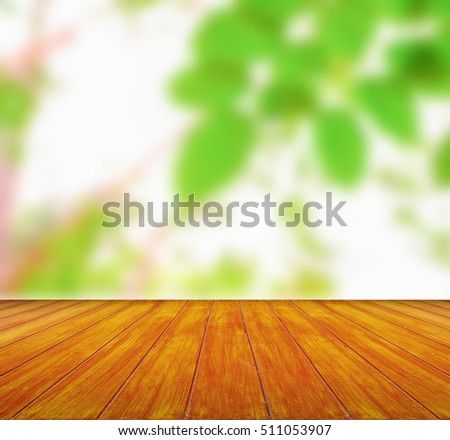 wooden plank under picture of nature background blurred.