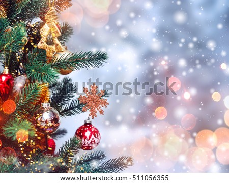 Christmas tree background and Christmas decorations with snow, blurred, sparking, glowing. Happy New Year and Xmas theme Royalty-Free Stock Photo #511056355