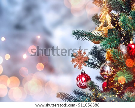Christmas tree background and Christmas decorations with snow, blurred, sparking, glowing. Happy New Year and Xmas theme Royalty-Free Stock Photo #511056388