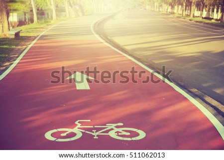 Bicycle path drawn on the asphalt road. Lanes for cyclists. Traffic signs and road safety.Thailand