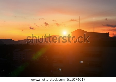 silhouette building   in city and sun sky  with color tone sunset, beautiful colorful evening nature landscape twilight time