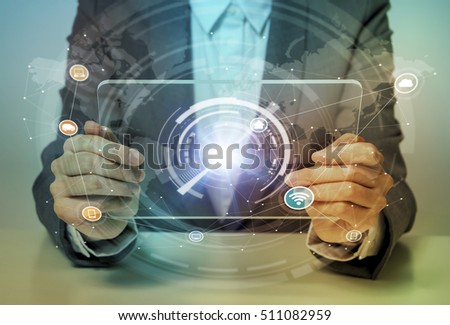 woman looks transparent monitor panel that indicates technological graphics, IoT(Internet of Things), ICT(Information Communication Technology), CPS(Cyber-Physical Systems), abstract Royalty-Free Stock Photo #511082959