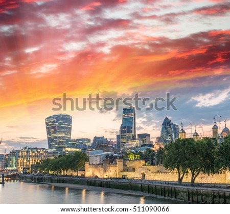 London skyline at sunset along Thames.