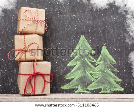 Christmas gift boxes and hand drawn xmas fir tree with snow