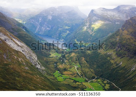 Classic summer picture of norwegian valley and fjord Geirangerfjord from the Dalsnibba mountain observation deck