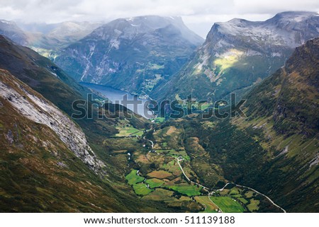 Classic summer picture of norwegian valley and fjord Geirangerfjord from the Dalsnibba mountain observation deck