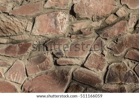 old wall of granite stones background