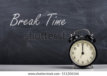  Text Break Time handwritten with white chalk on a blackboard and retro alarm clock Royalty-Free Stock Photo #511206166