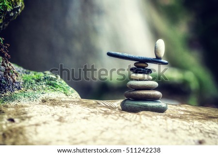 Balanced Rock Zen Stack in front of waterfall. Royalty-Free Stock Photo #511242238
