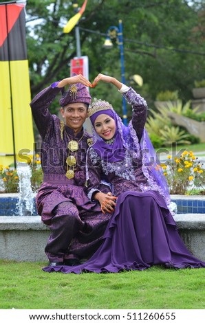 Malay couple bride wearing traditional style wedding dress ( soft focus at full resolution )
