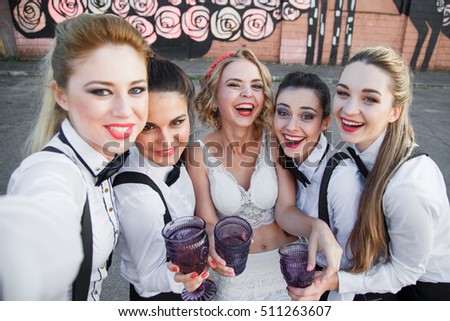 Friends, bachelorette party and holidays concept - happy smiling young pretty women with champagne glasses taking selfie at night club
