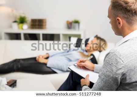 Woman lying on couch at doctors office Royalty-Free Stock Photo #511277248