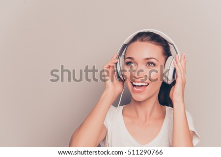 Portrait of happy music lover listening music and singing