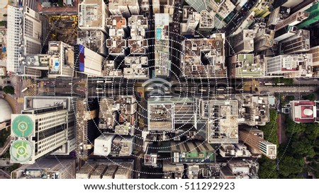 Top view aerial photo of a Hong Kong Global cityscape with development buildings, transportation, energy power infrastructure. Financial and business centers with infographics wireless connection icon